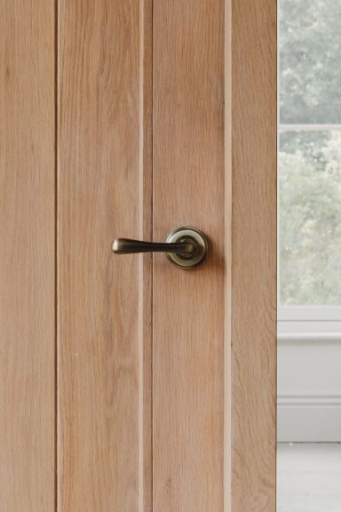 Antique brass hardware fitted to a bespoke joinery in Sheffield.