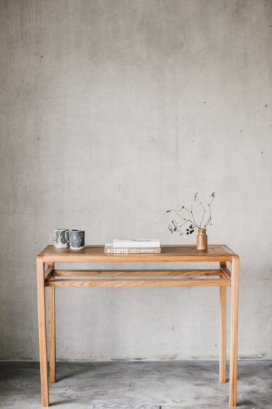 Hardwood side table made of Elm with unique curves, handmade by Phillip Davies bespoke joinery in Sheffield.