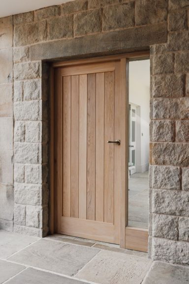 Custom hardwood door made in Sheffield from oak. Bespoke made to measure joinery by Phillip Davies.