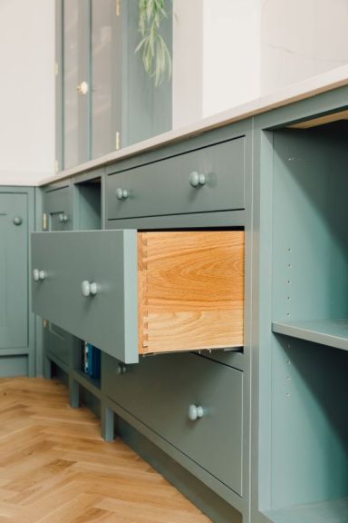 Handmade dovetailed kitchen drawers in oak with beautiful grain.