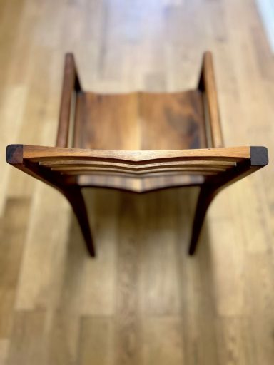 Bespoke handmade chair made from American black walnut in Sheffield. Unique curved back design by Phillip Davies.