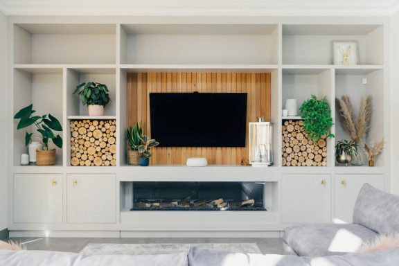 Bespoke furniture with a media unit and down lighting. Made in Sheffield.