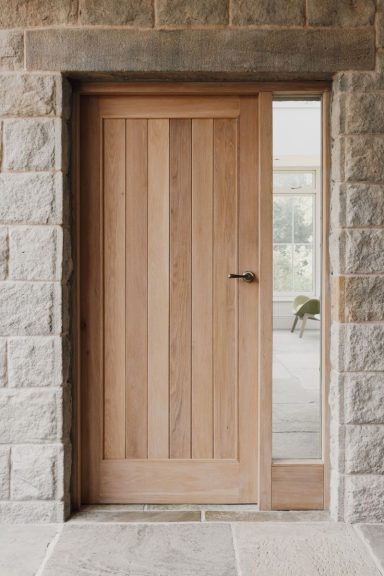 Made to measure hardwood entrance door with bespoke panel design. Sheffield bespoke joinery by Phillip Davies.