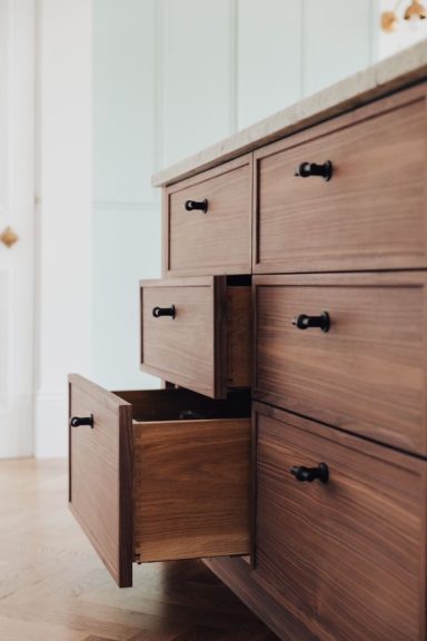 A bespoke kitchen island with dovetailed oak drawers.