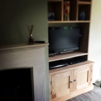 Custom Alcove cabinet made from Ash and fitted with a TV. Made for a customer in Sheffield.