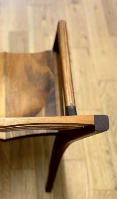Bespoke handmade chair made from American black walnut in Sheffield. Unique curved back design by Phillip Davies.