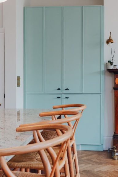 Bespoke kitchen pantry unit concealing coffee making station. Painted in Farrow and Ball Green blue.