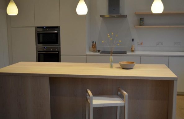Custom maple kitchen island with a hand made hardwood stool.