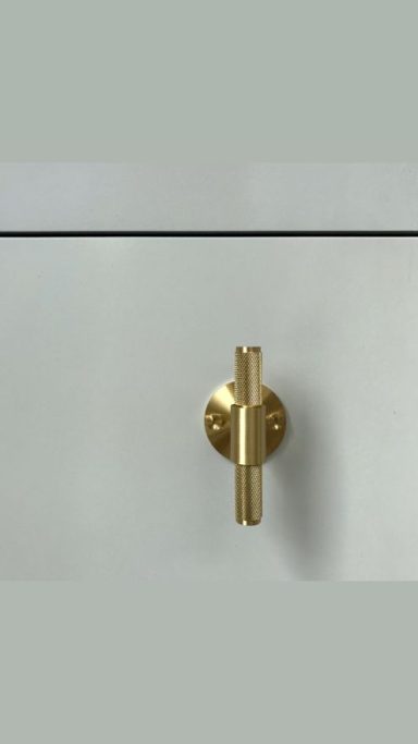 Custom grey media unit fitted with hardware from Buster and Punch.
