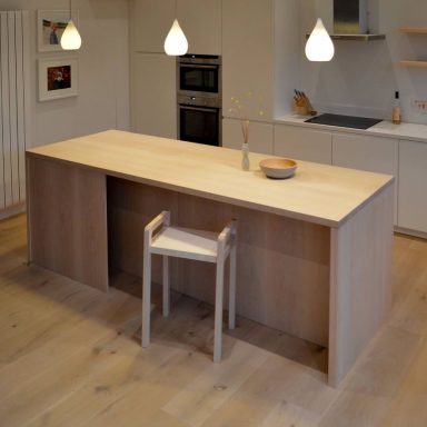 Bespoke kitchen island made from solid maple hardwood with seating area. Made by hand in Sheffield by Phillip Davies