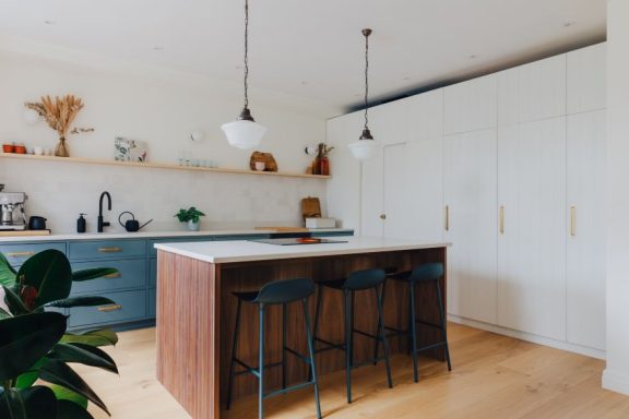 A bespoke kitchen with a walk in pantry and beautiful island.